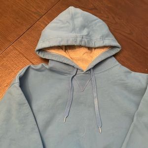 Men’s large pullover hoodie. Light blue. Slightly worn.
